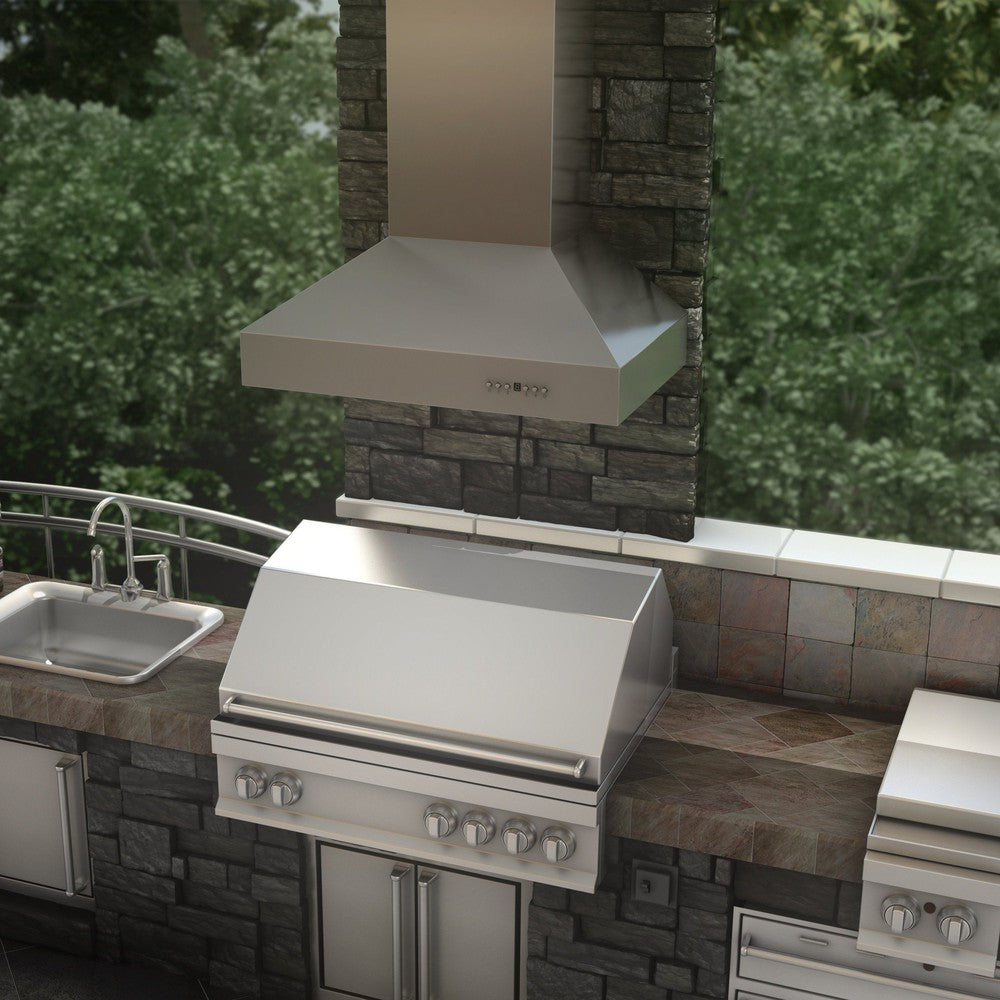 ZLINE Outdoor Wall Mount Range Hood in Outdoor Approved Stainless Steel (667-304) rendering above an outdoor barbecue from above.
