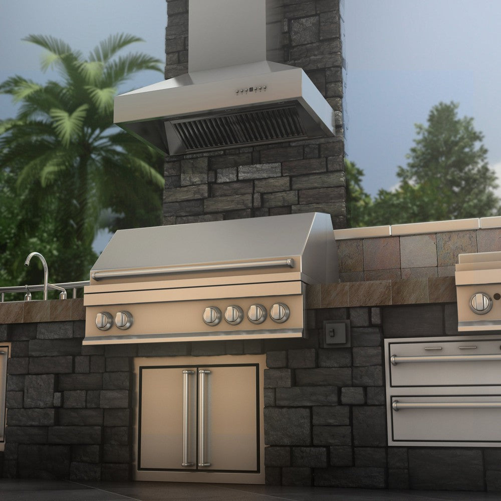 ZLINE Ducted Wall Mount Range Hood in Outdoor Approved Stainless Steel (697-304) rendering above barbecue in outdoor kitchen from below.