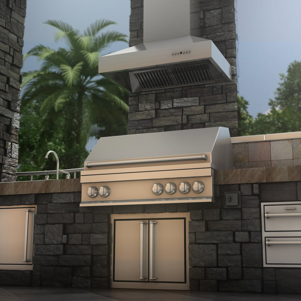 ZLINE Outdoor Wall Mount Range Hood in Outdoor Approved Stainless Steel (667-304) rendering above an outdoor barbecue from below.