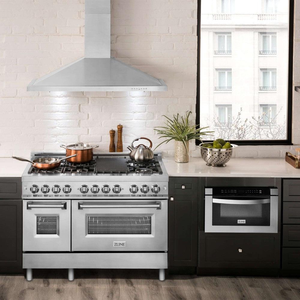 ZLINE Convertible Vent Wall Mount Range Hood in Stainless Steel (KB) in rustic apartments kitchen with matching ZLINE Range and Microwave