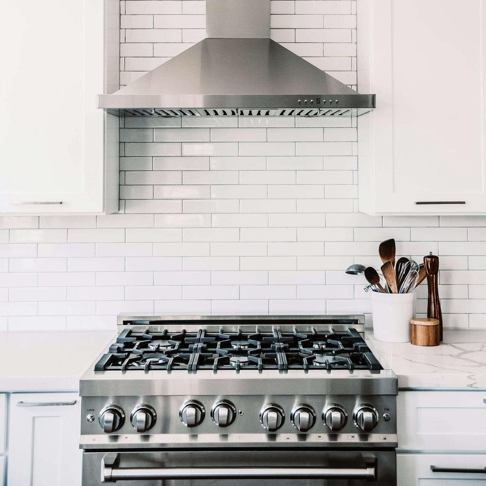 ZLINE Convertible Vent Wall Mount Range Hood in Stainless Steel (KB) in rustic cottage kitchen above ZLINE dual fuel range