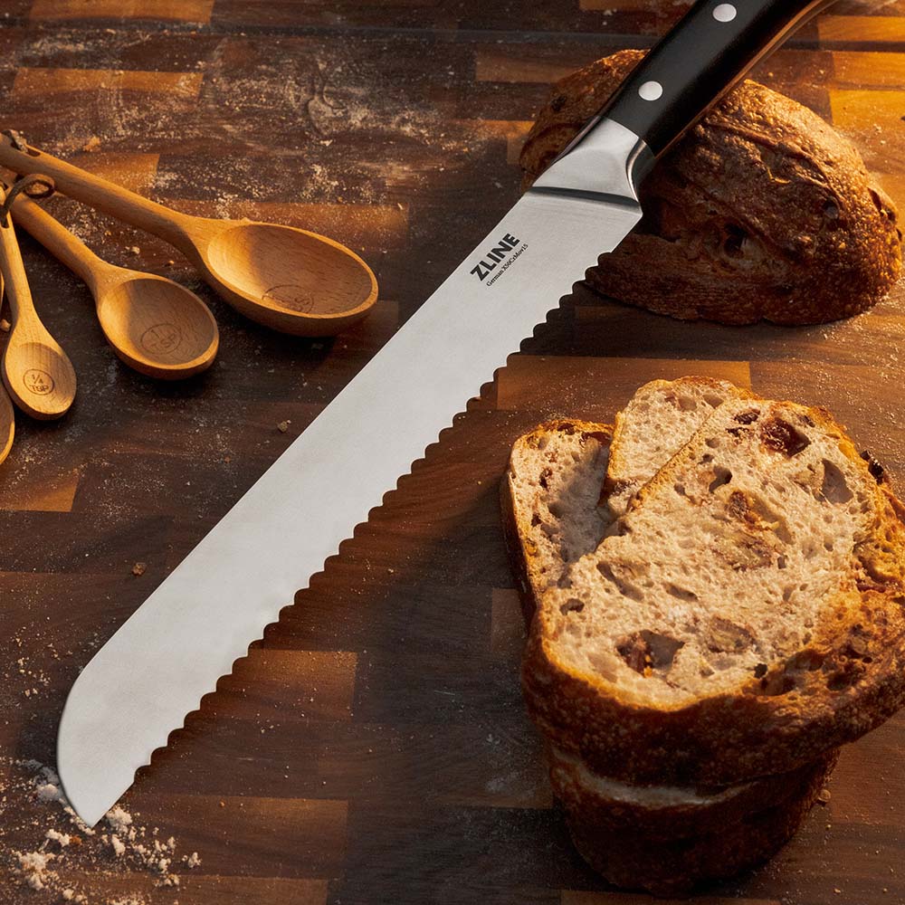 ZLINE bread knife on cutting board next to sourdough slices