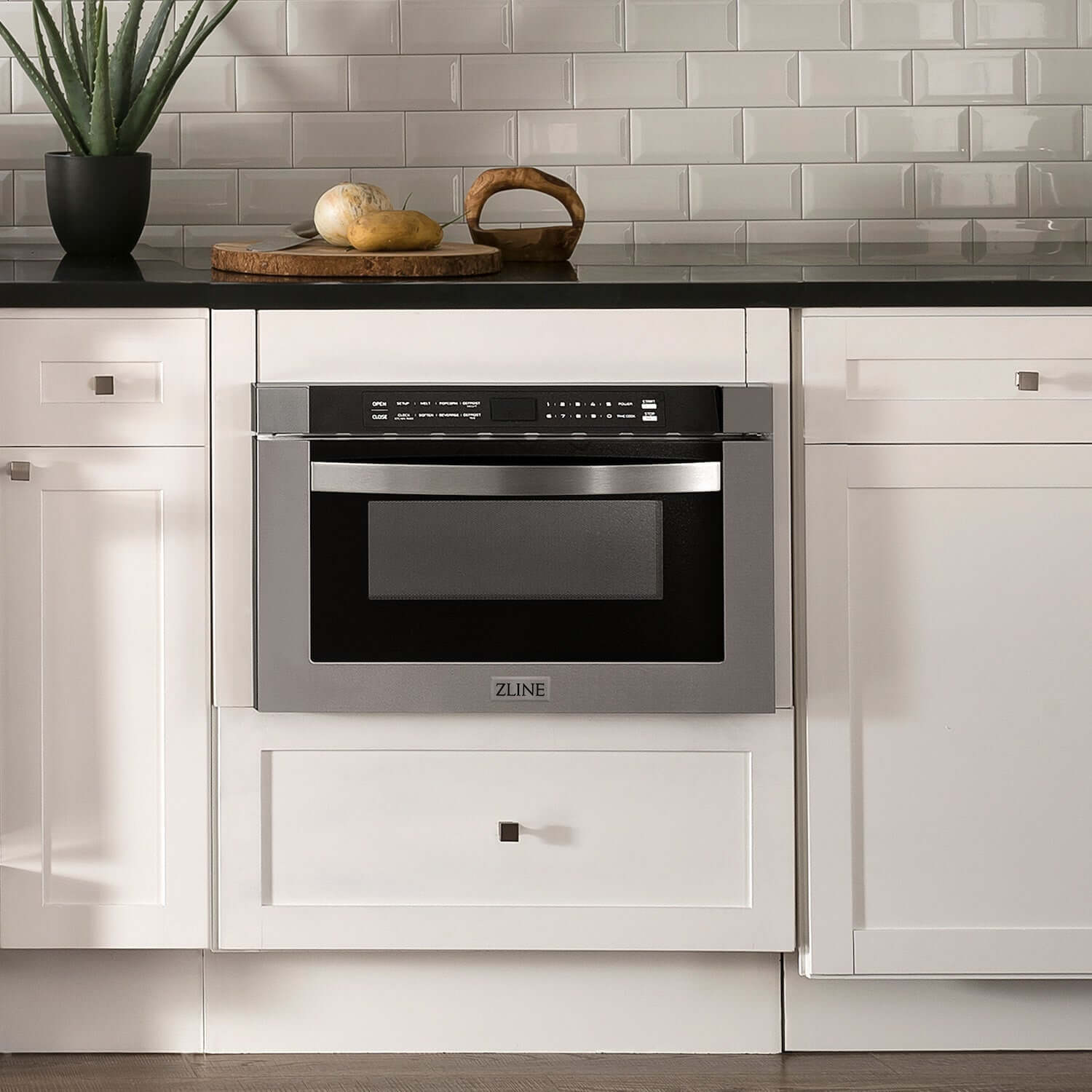 ZLINE 24" Built-in Microwave Drawer installed into white cabinets in a farmhouse-style kitchen.