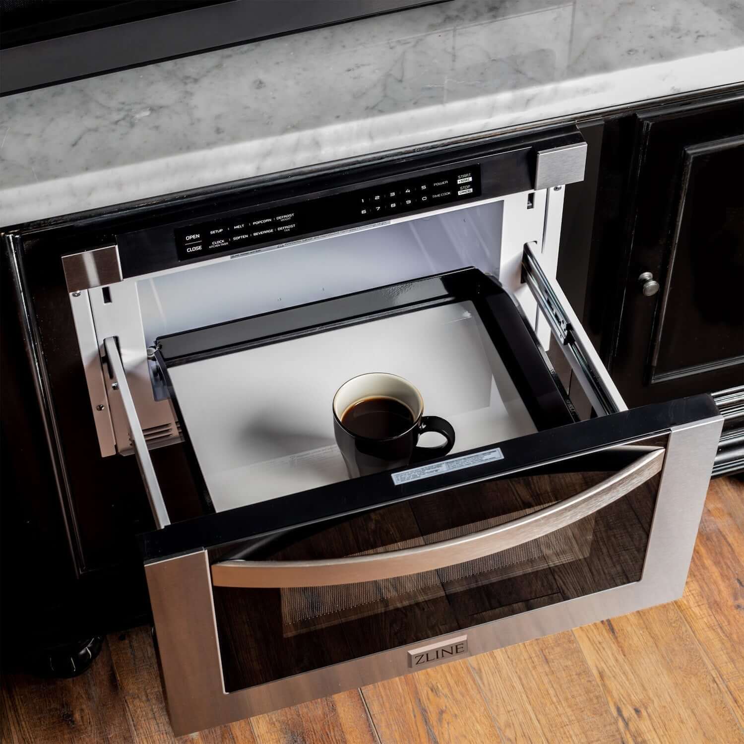 Cup of coffee inside ZLINE 24" Built-in Microwave Drawer from above.