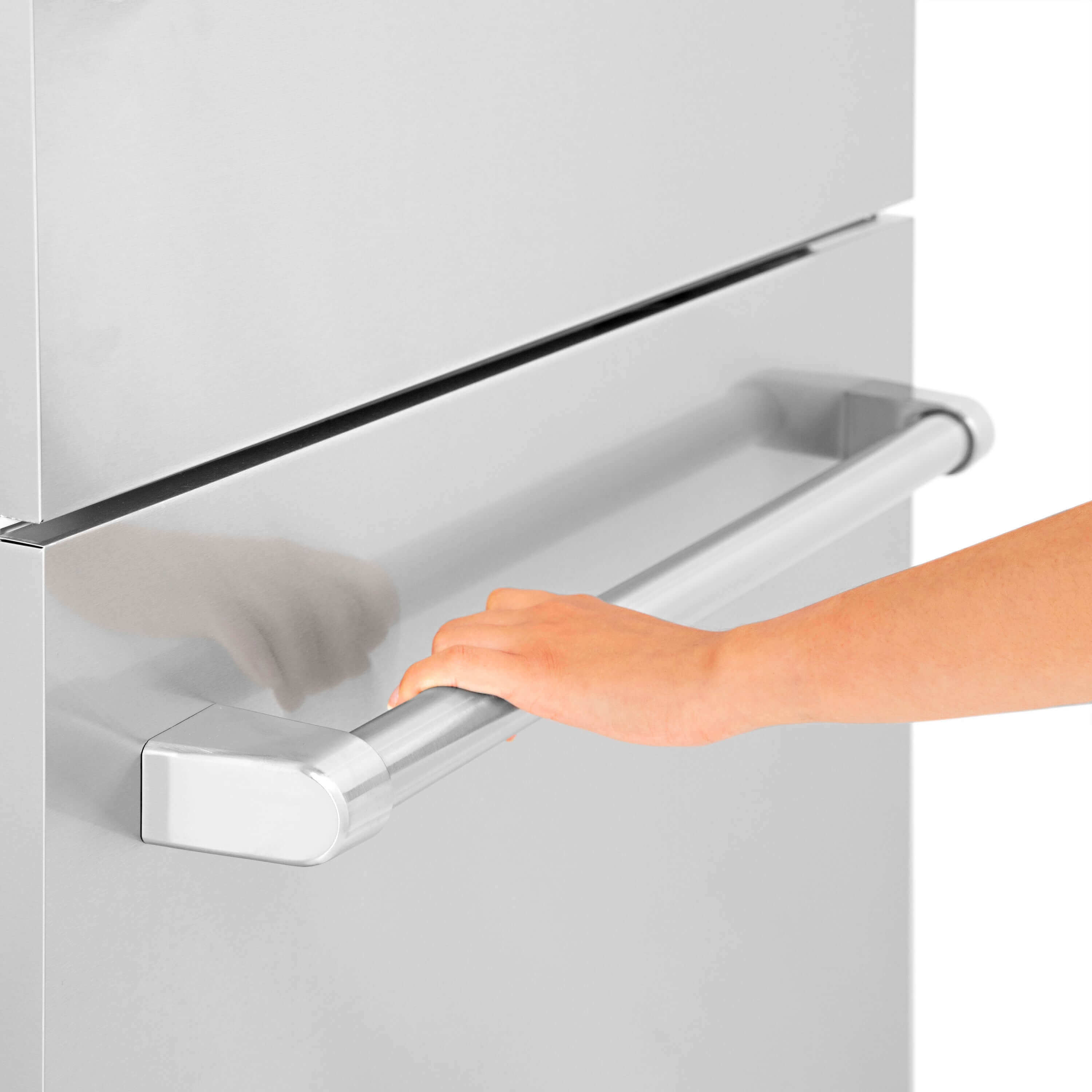 Opening the bottom freezer compartment on ZLINE built-in refrigerator.
