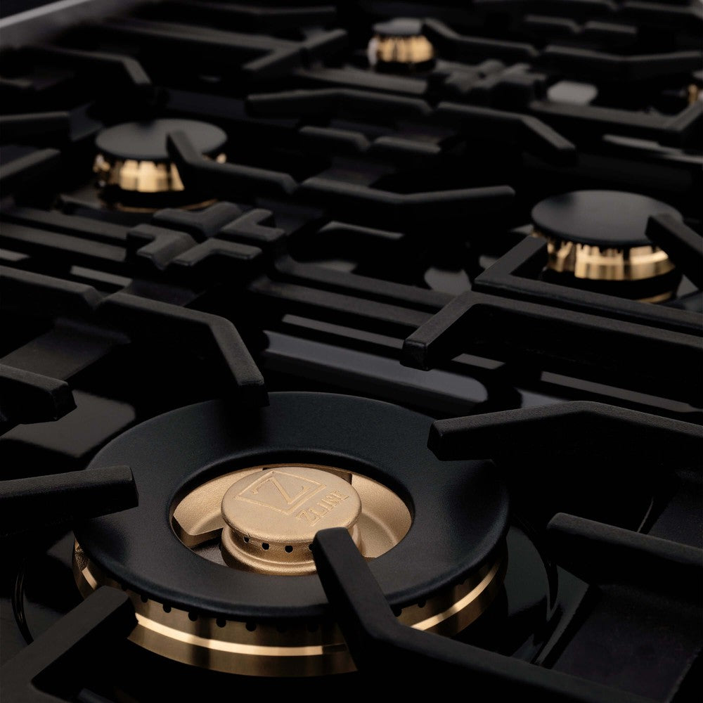 ZLINE brass burners with continuous cast-iron grates close up.