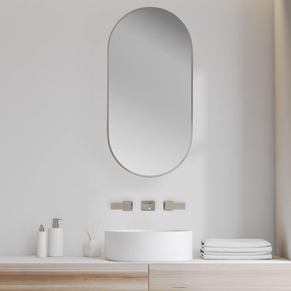 ZLINE Bliss Wall Mount Bath Faucet (BLS-BFW) Brushed Nickel in a luxury bathroom with a large oval mirror