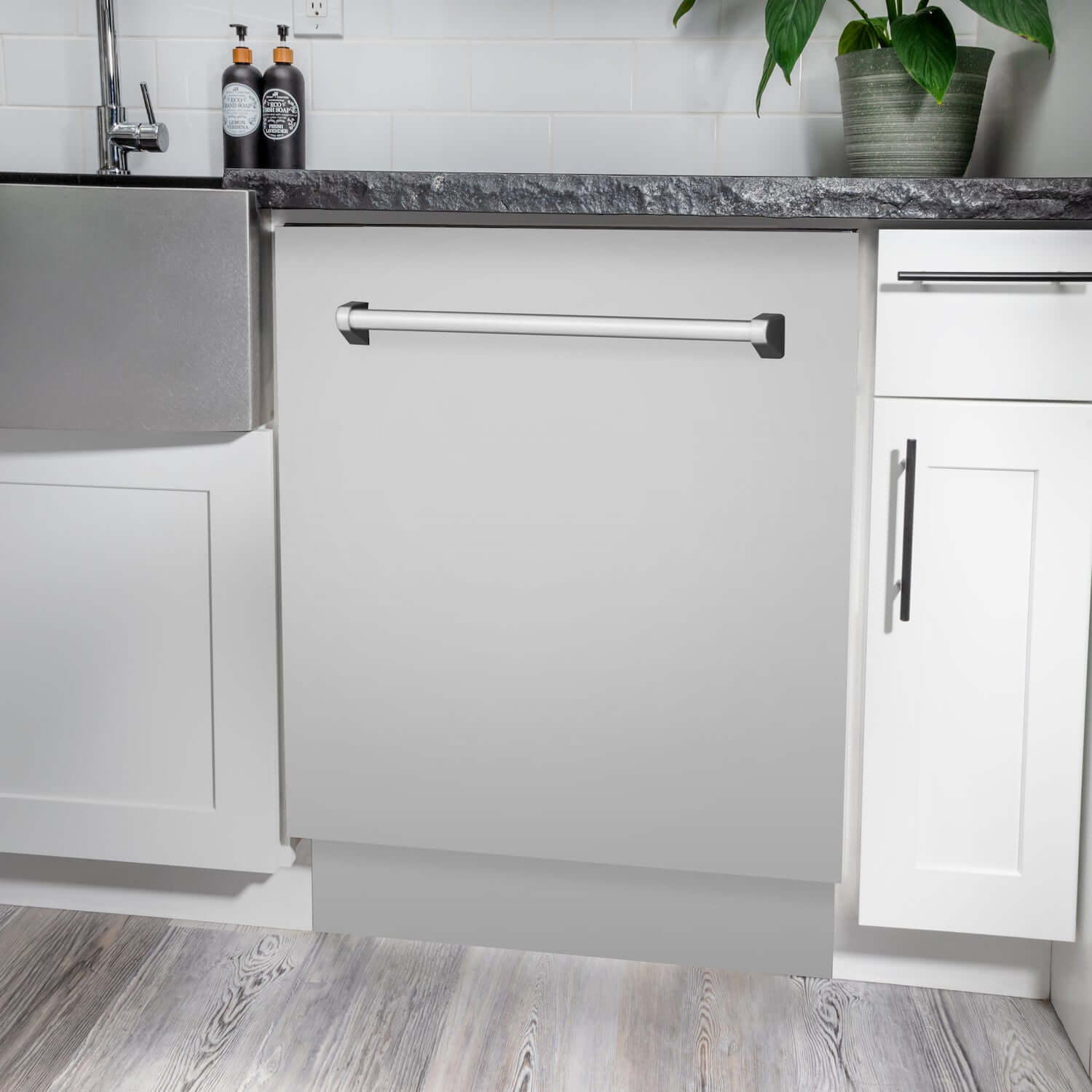 ZLINE 24" Stainless Steel Dishwasher built-in to cabinets below counters in a kitchen.