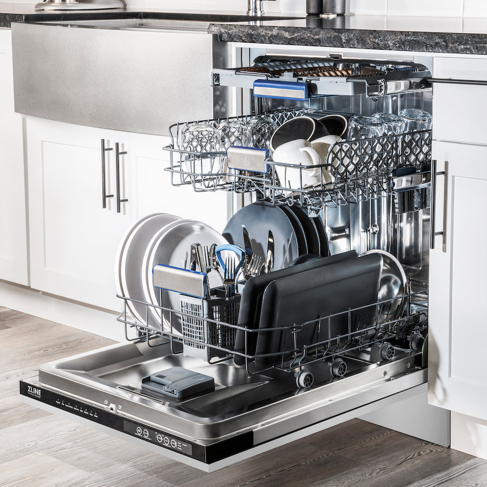 ZLINE 24" Stainless Steel Dishwasher in a kitchen loaded with dishes, glassware, and utensils.