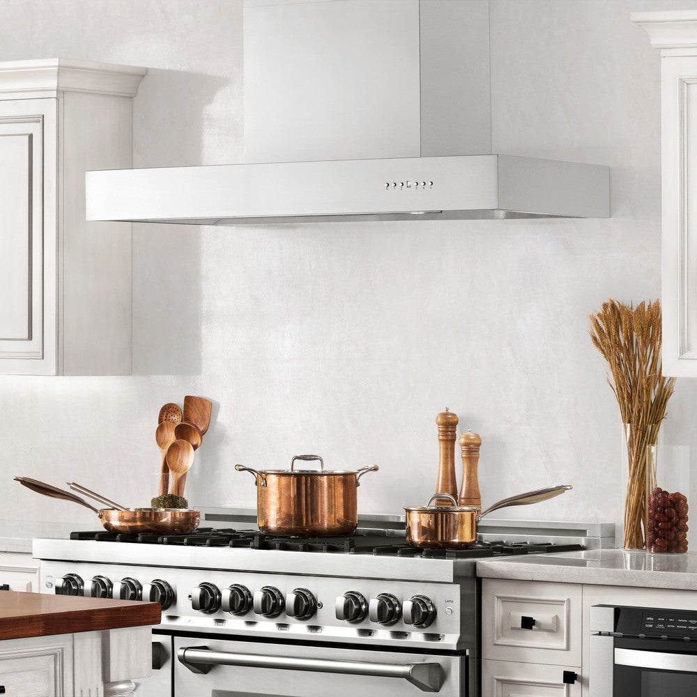 ZLINE Convertible Professional Wall Mount Range Hood in Stainless Steel (KECOM) above a double oven range in a luxury cottage kitchen.
