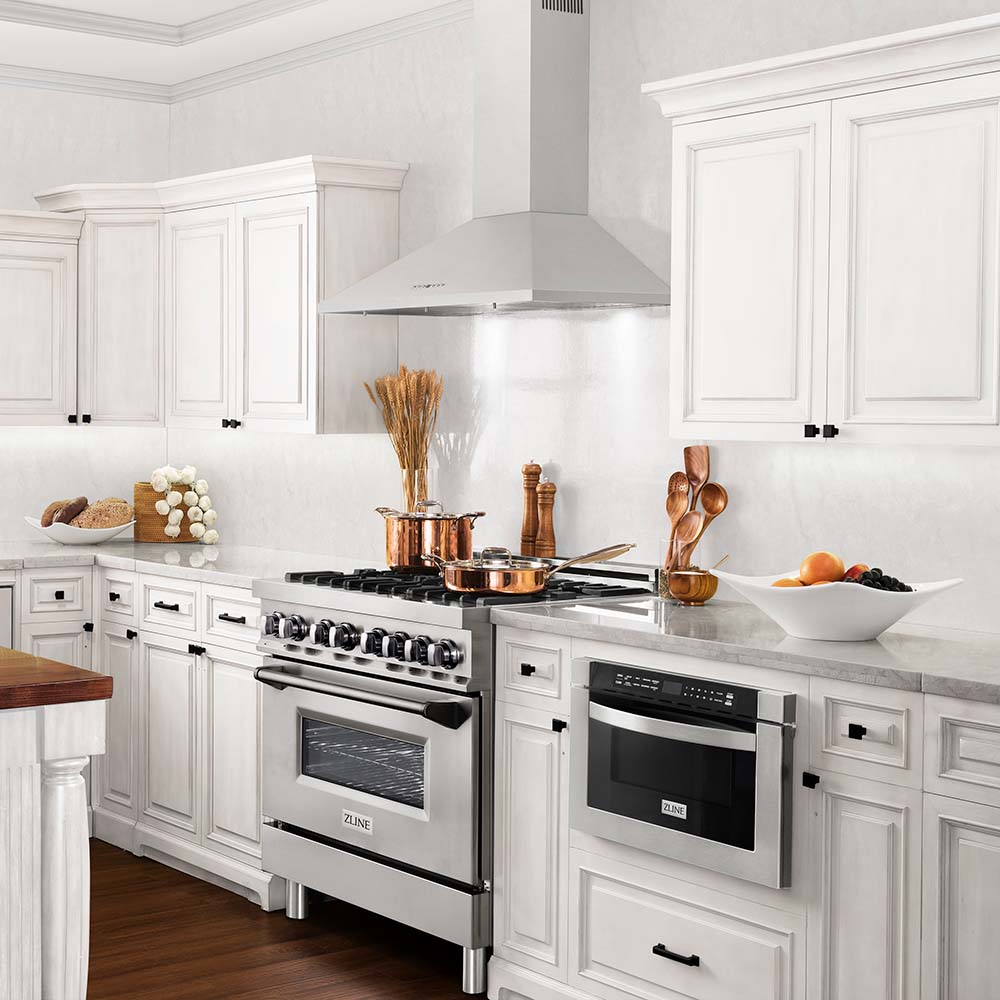 ZLINE kitchen appliances in luxury farmhouse kitchen with white cabinets and countertops
