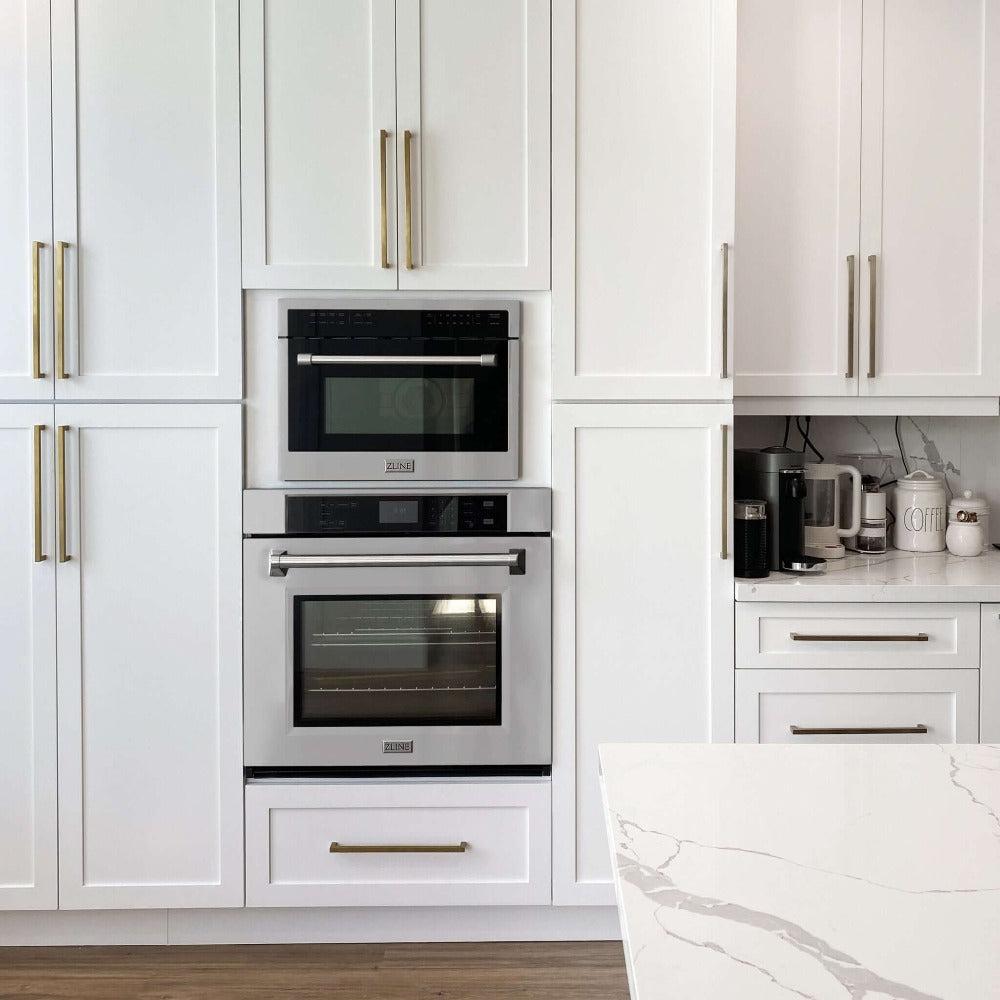 ZLINE 24 in. Stainless Steel Built-in Convection Microwave Oven with Speed and Sensor Cooking (MWO-24) installed above a wall oven in a luxury farmhouse kitchen, front.