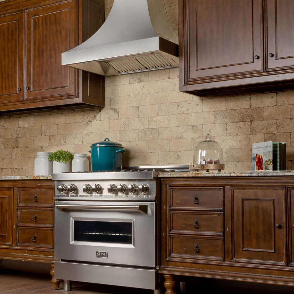 ZLINE Designer Series Fingerprint Resistant Stainless Steel Wall Range Hood (8632S) in a rustic-style kitchen, side.