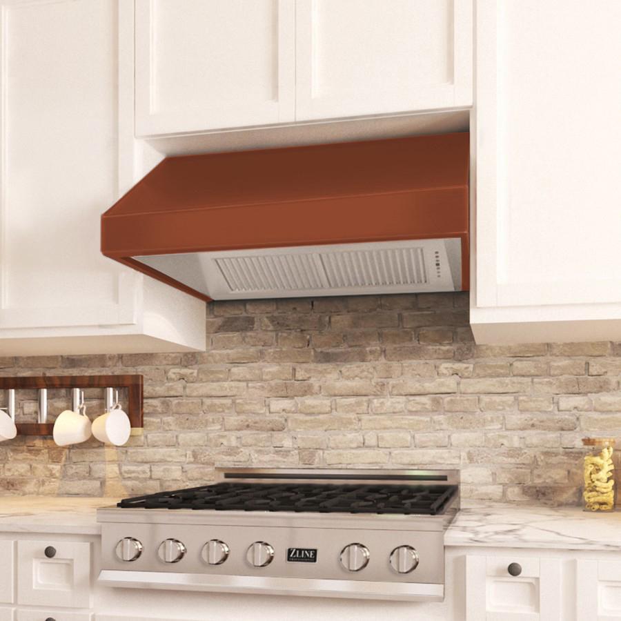 ZLINE Designer Series Under Cabinet Range Hood (8685C) in a cottage-style kitchen above a range top.