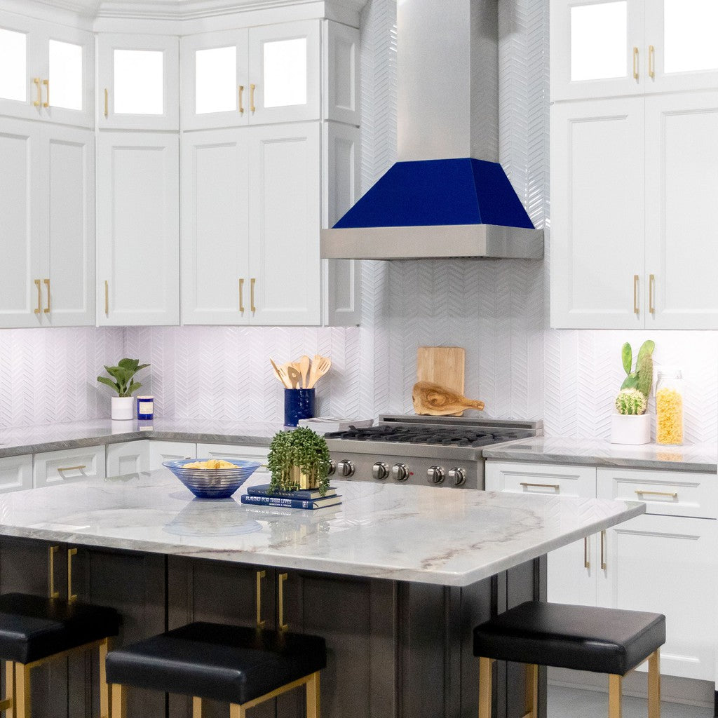ZLINE Ducted Fingerprint Resistant Stainless Steel Range Hood with Blue Gloss Shell (8654BG) with matching blue gloss range in a white cottage-style kitchen from across island.