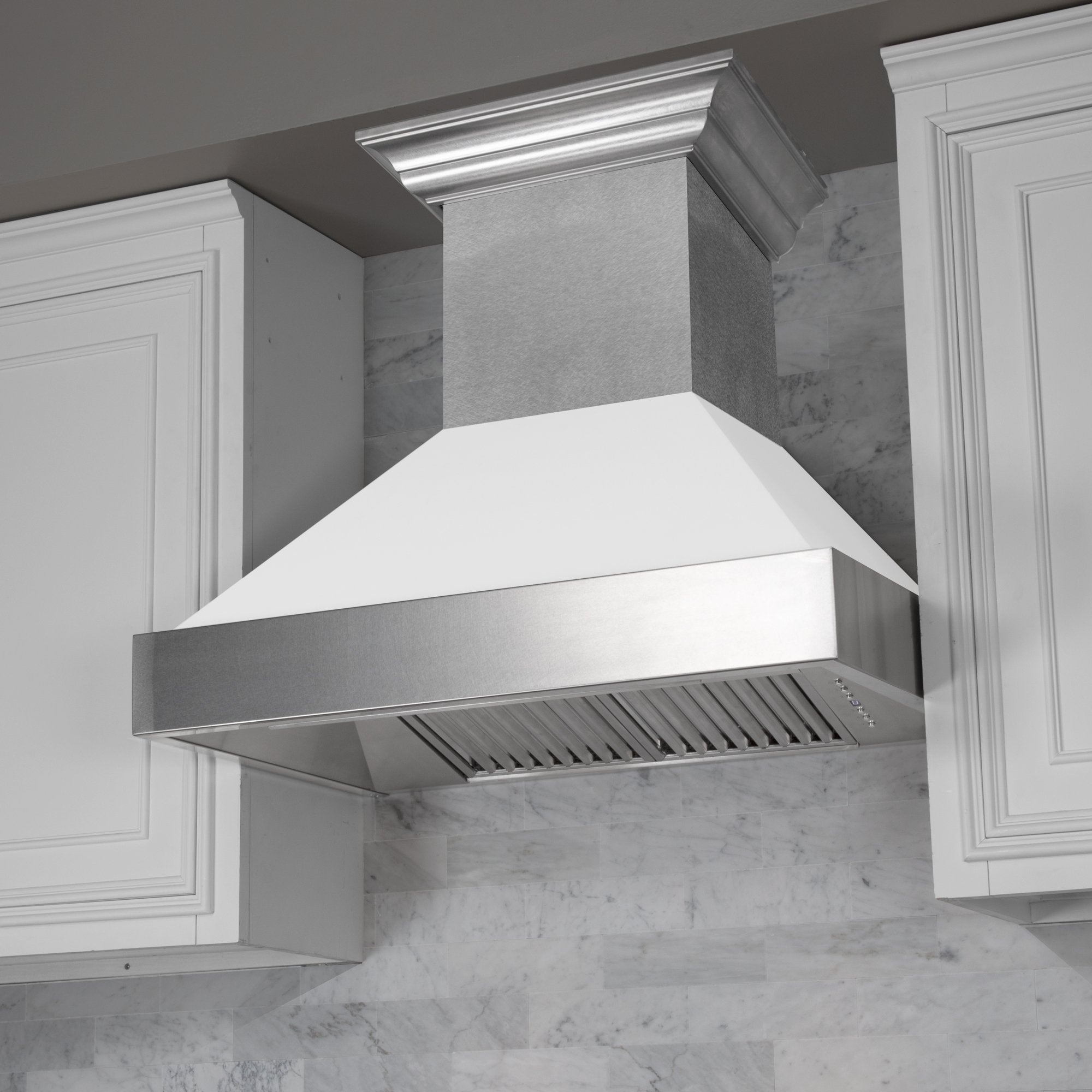 ZLINE Fingerprint Resistant Stainless Steel Range Hood With White Matte Shell (8654WM) with a short chimney in a kitchen.