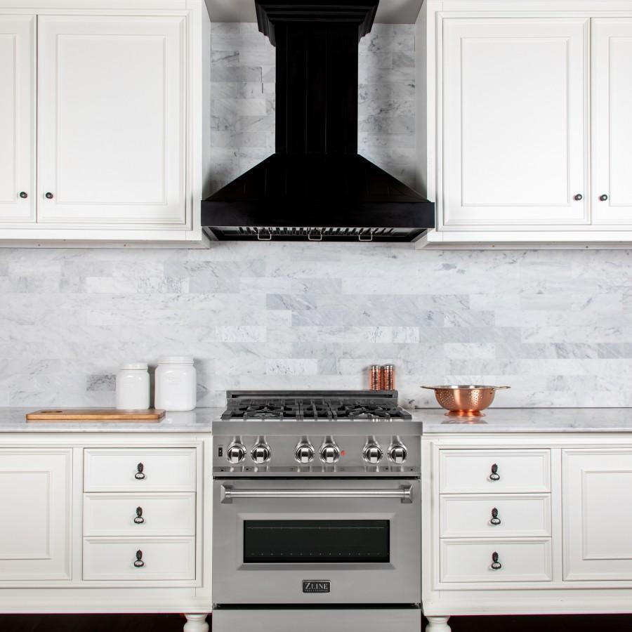 ZLINE Wooden Wall Mount Range Hood In Black in a farmhouse-style kitchen above a range from front.